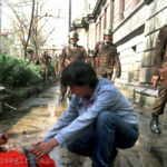 Verletzte Frau während einer Protestkundgebung in der Paseo Ahumada in Santiago, Chile am 19.08.1988.